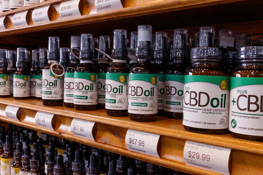 cbd oil products on shelves in a store