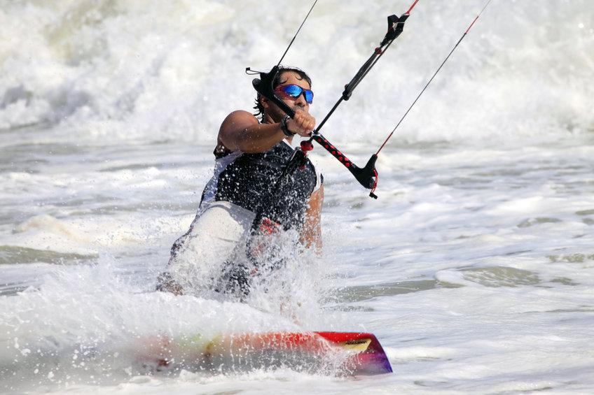 a man is kite surfing in the ocean