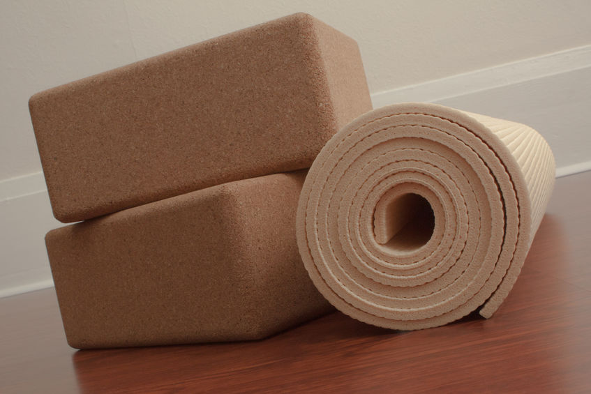 a yoga mat and a roll of cork
