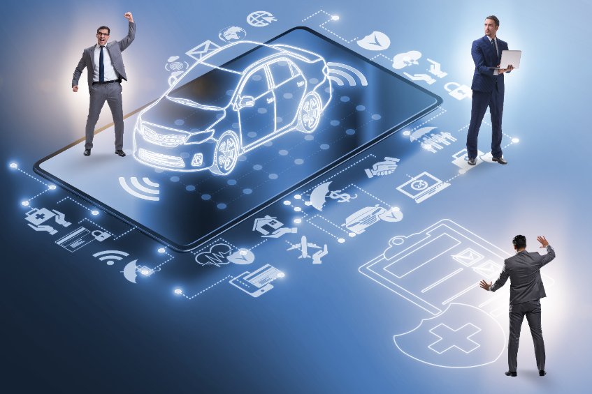business people standing in front of a car with icons on it