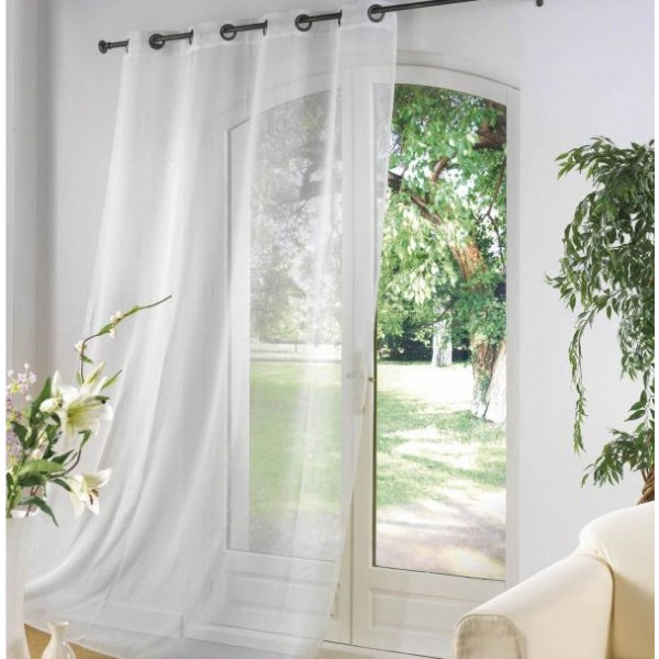 a white curtain with sheer material hanging from the window