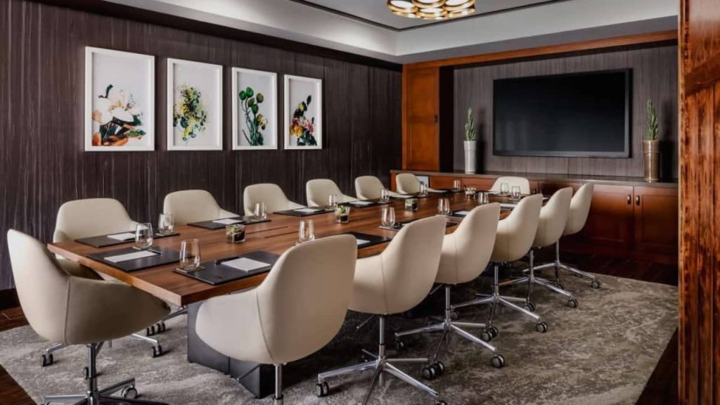 a conference room with a large table and chairs